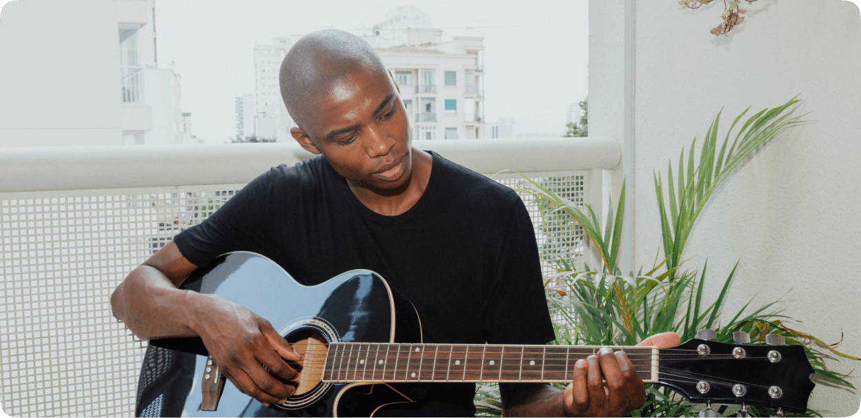 Guitarist playing on balcony