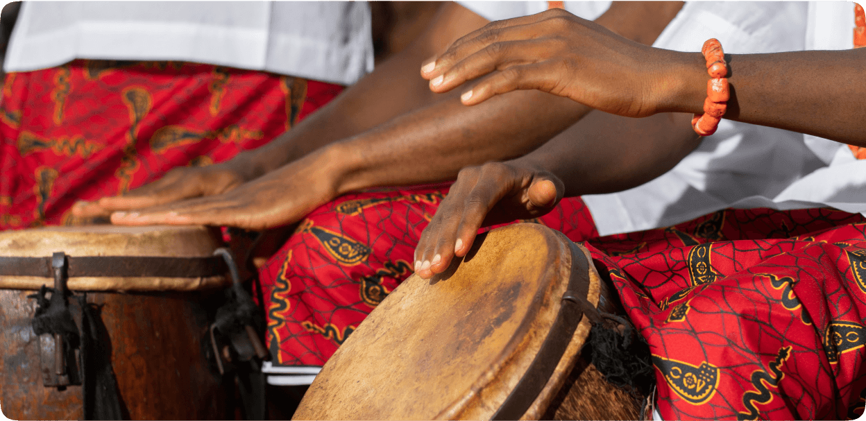 Hands playing traditional drums